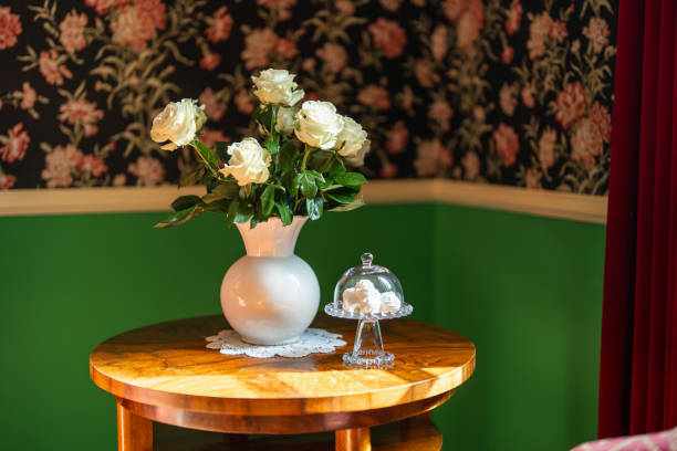 pink flower in jar on wood table with space for text