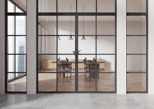 istock Home living room interior with eating table behind glass doors, panoramic window 2167348777