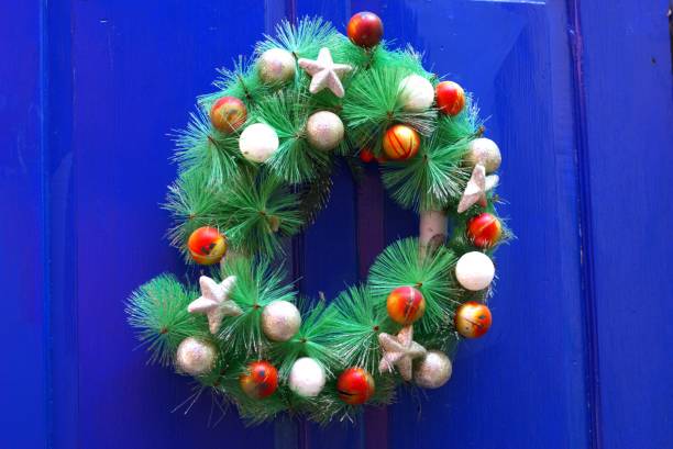 istock Christmas wreath on a blue wooden background 2167348922