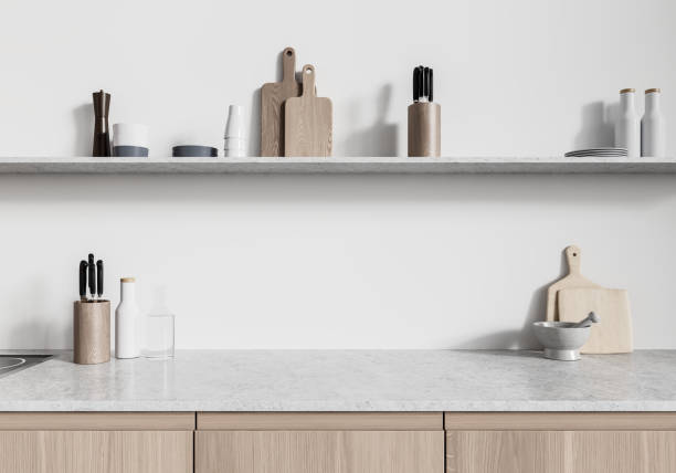 istock White home kitchen interior with cabinet and kitchenware on shelf 2167348943