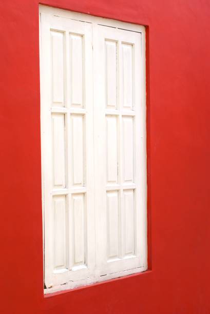 istock retro style white wooden window on a red wall 2167348965
