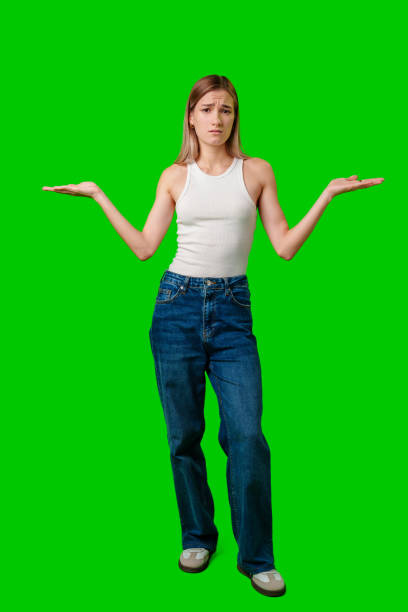 istock Young Woman Gesturing With Hands Against A Green Screen 2167349139