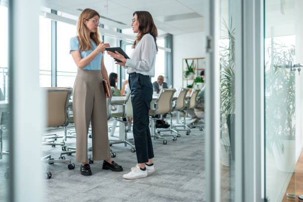 istock Professional Engagement Between Joyful Female Colleagues in Office 2167349247