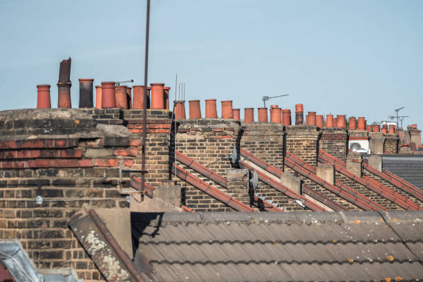 istock Brick chimneys and rooftop in Victorian terraced houses 2167349580