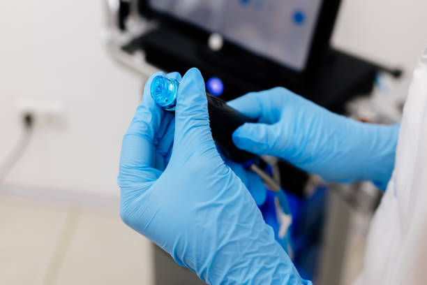 A cosmetologist sets up a Hydradermabrasian device in a modern spa clinic, getting ready for an advanced facial treatment. Ideal for promoting cutting-edge skincare solutions, anti-aging, and acne-fighting
