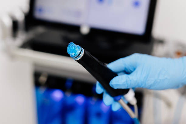 istock A cosmetologist sets up a Hydradermabrasian device in a modern spa clinic, getting ready for an advanced facial treatment. Ideal for promoting cutting-edge skincare solutions, anti-aging, and acne-fighting 2167350130