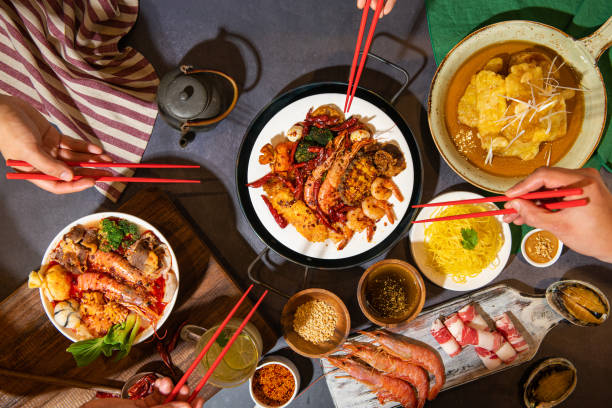 istock picking up food with chopsticks on the table. 2167350226