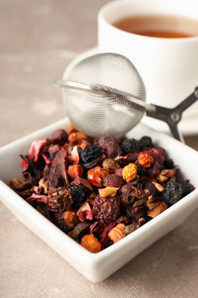 Concept of cooking tea with different types of tea on light textured background