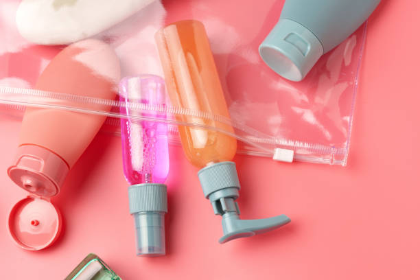 istock Clear Plastic Bag Containing Travel-Sized Toiletries on Pink Background 2167353396