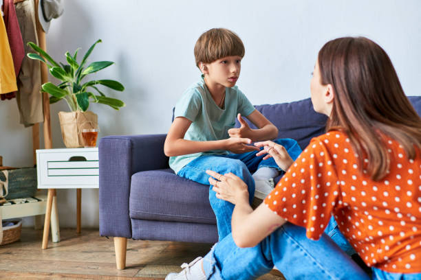 istock Mother and son share precious moments while communicating in a cozy living room 2167355692