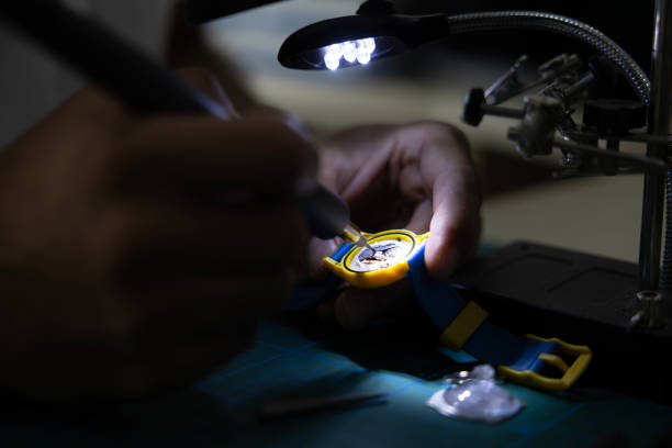 close up of fixing a clock