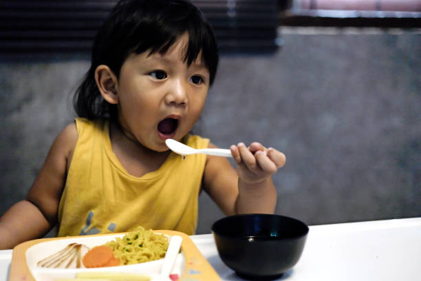 istock A Little Boy Eating Soup And Noodle 2167360729