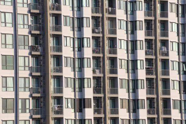 Facade of tall apartment tower block in Bangkok Huai Khwang