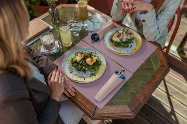istock Women dining at an outdoor cafe 2167363242