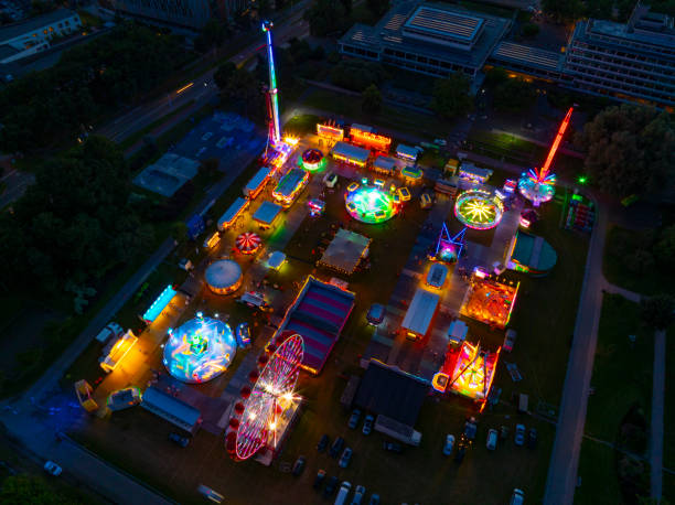 istock Fair during sunset with illuminated fairground attractions seen from above 2167364728