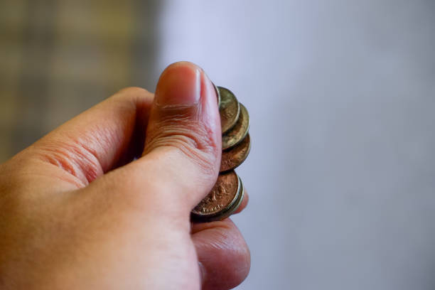 United States of America USD cash money of dollars of 100 dollars background with coins of different cents and change of a dollar, American money exchange rate, economic, growth, inflation concept