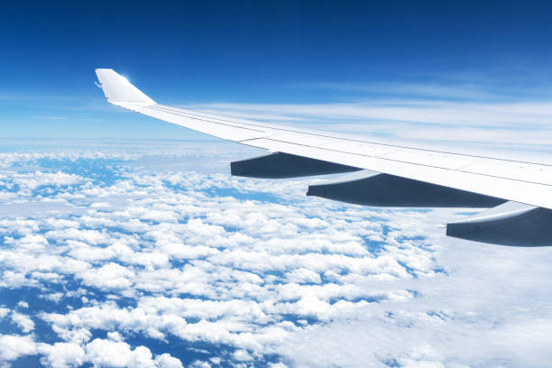 istock View of clouds and wing from a plane window 2167370298