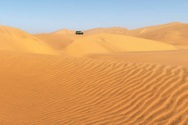 istock Orange sand dunes and clear sky in Namib desert 2167370514