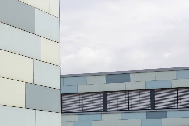 Partial view of a modern office building with a blue-grey facade