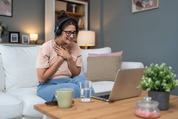 Emotional support. Young sick woman, or freshly divorced, relationship breakup, being fired from work, having video call on laptop computer with friends and family, online therapy with psychologist.