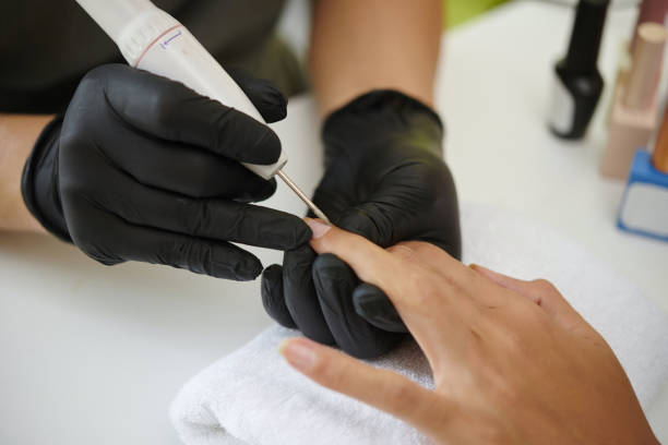istock Conducting Manicure Procedure with Electric Nail File 2167374784