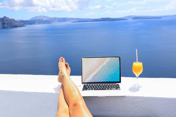 istock Summer view with Nomad digital as laptop  which running remotely and bright scenic view near mediterranean sea on the beach in summer time 2167374796
