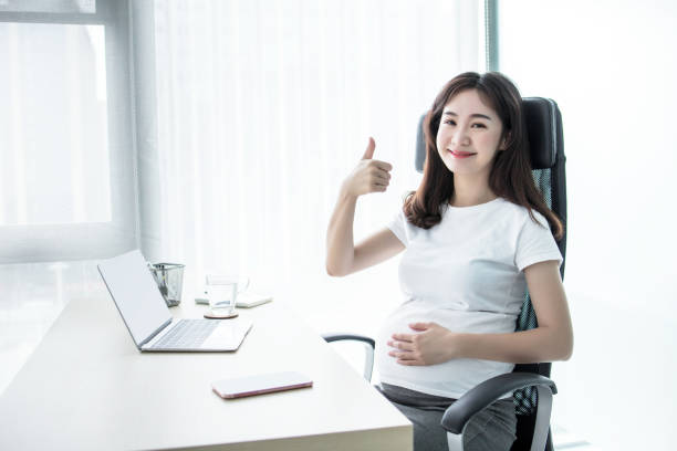 istock Pregnant woman working from home office. 2167376360