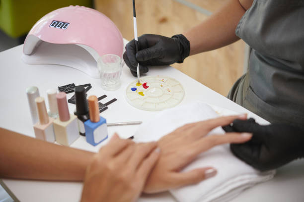 Painting Nails During Professional Manicure Session