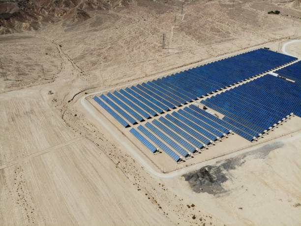 istock Solar panels power station desert aerial view 2167377747