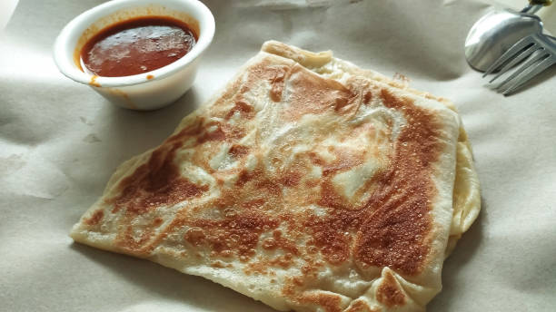 istock roti prata with fish curry sauce 2167378805