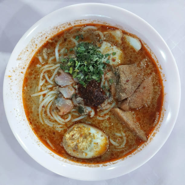 istock laksa soup with white noodles in a white bowl 2167379208