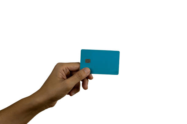 istock Woman's hand holding a credit card isolated on white background. 2167379831