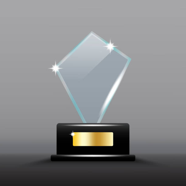 istock Glass diamond trophy. Black base with gold plate. Shiny reflective surface. Elegant award design. 2167381022