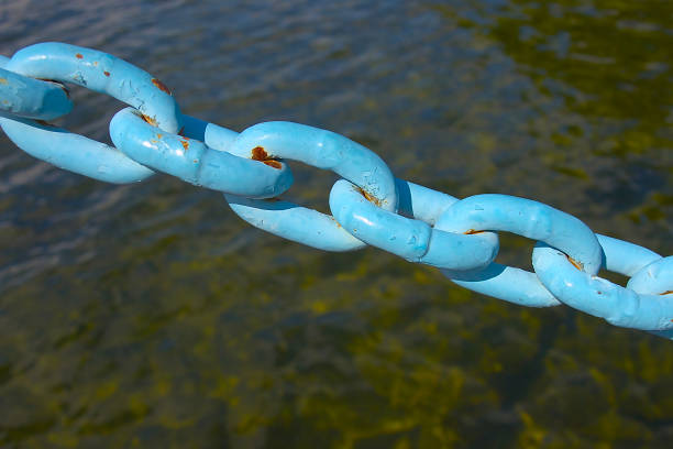 painted iron chain on a background of water