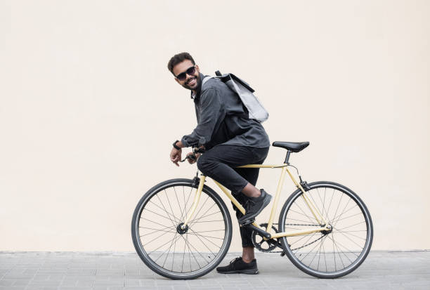 istock Handsome young man with bicycle in a city 2167385852