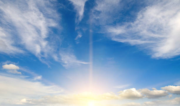 istock Blue sky with clouds and bright sun. Wide photo. 2167386783