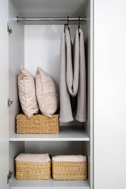 istock Bed linen in boxes close to pillows and folding blankets in closet 2167388508