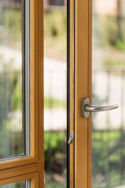 istock Wooden frame on balcony door with silver handle open 2167388535