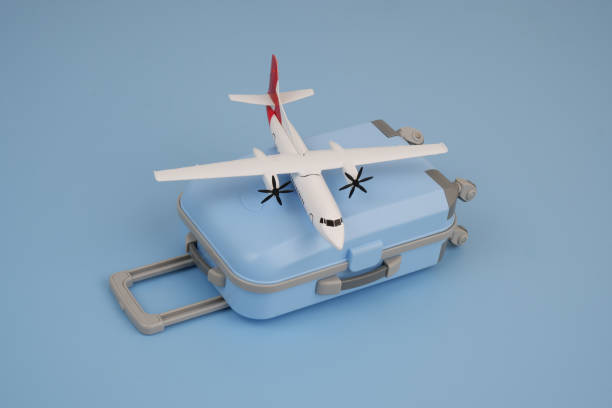istock Airplane model on blue travel suitcase on blue background. 2167388844