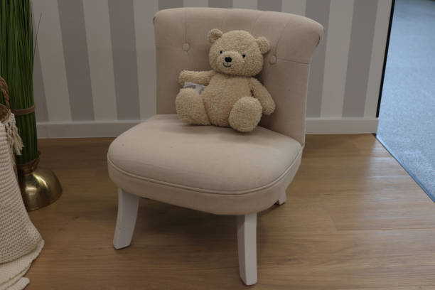 istock Teddy bear in a chair as decoration 2167393895