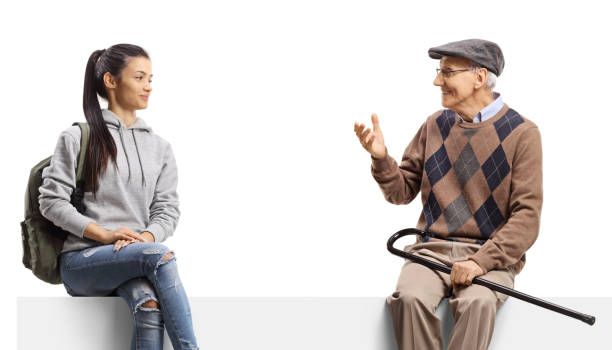 istock Female student sitting on a panel and listening to an elderly man talking 2167394813