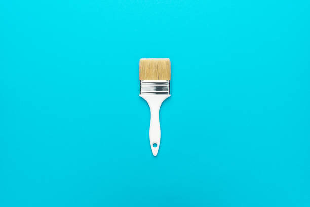 istock Paint brush on the turquoise blue background 2167394927