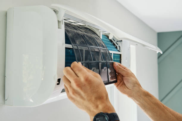 istock Air conditioner maintenance. Male technician repairing cooling system 2167396137
