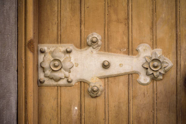 istock Ornamented hinge in old door 2167396731