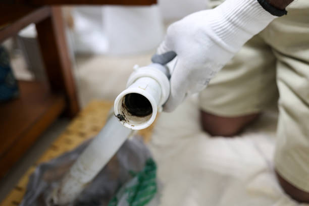 istock Black man cleaning clogged bathroom sink pipe 2167399819