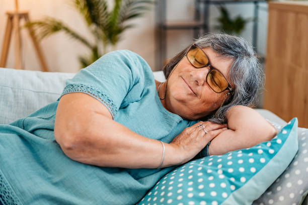 istock Senior Woman Sleeping On The Sofa At Home 2167401810