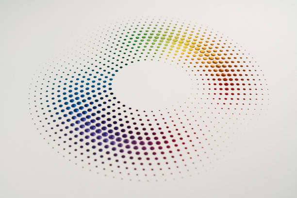 istock Minimalistic circular pattern of multicolored paper dots meticulously arranged on a clean white background. 2167403151