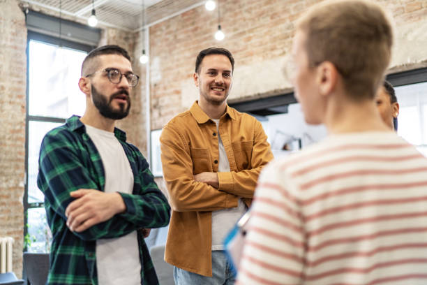 istock Young colleagues having a casual discussion in the office 2167405407