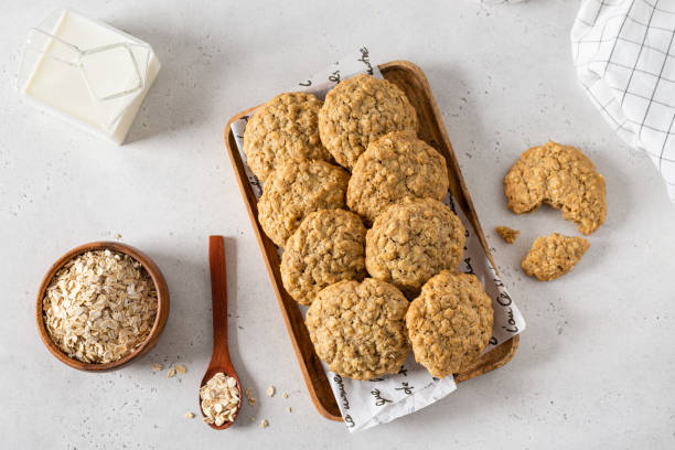 istock Breakfast with healthy oatmeal cookies on stone background. Top view, flat lay. Cereal biscuits recipe 2167405747