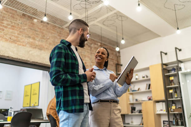 istock Young diverse colleagues having a casual business discussion 2167407308
